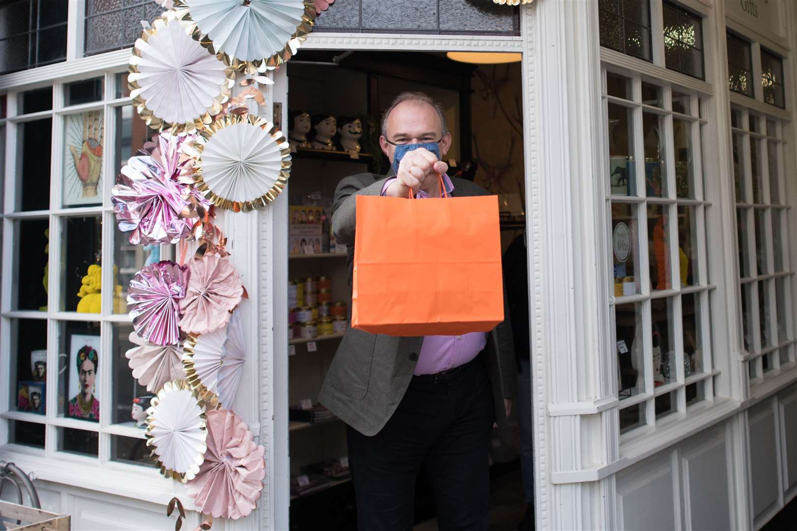 Liberal Democrat leader Sir Ed Davey leaving a shop, with a purchase, in St Albans in Hertfordshire (Stefan Rousseau/PA)