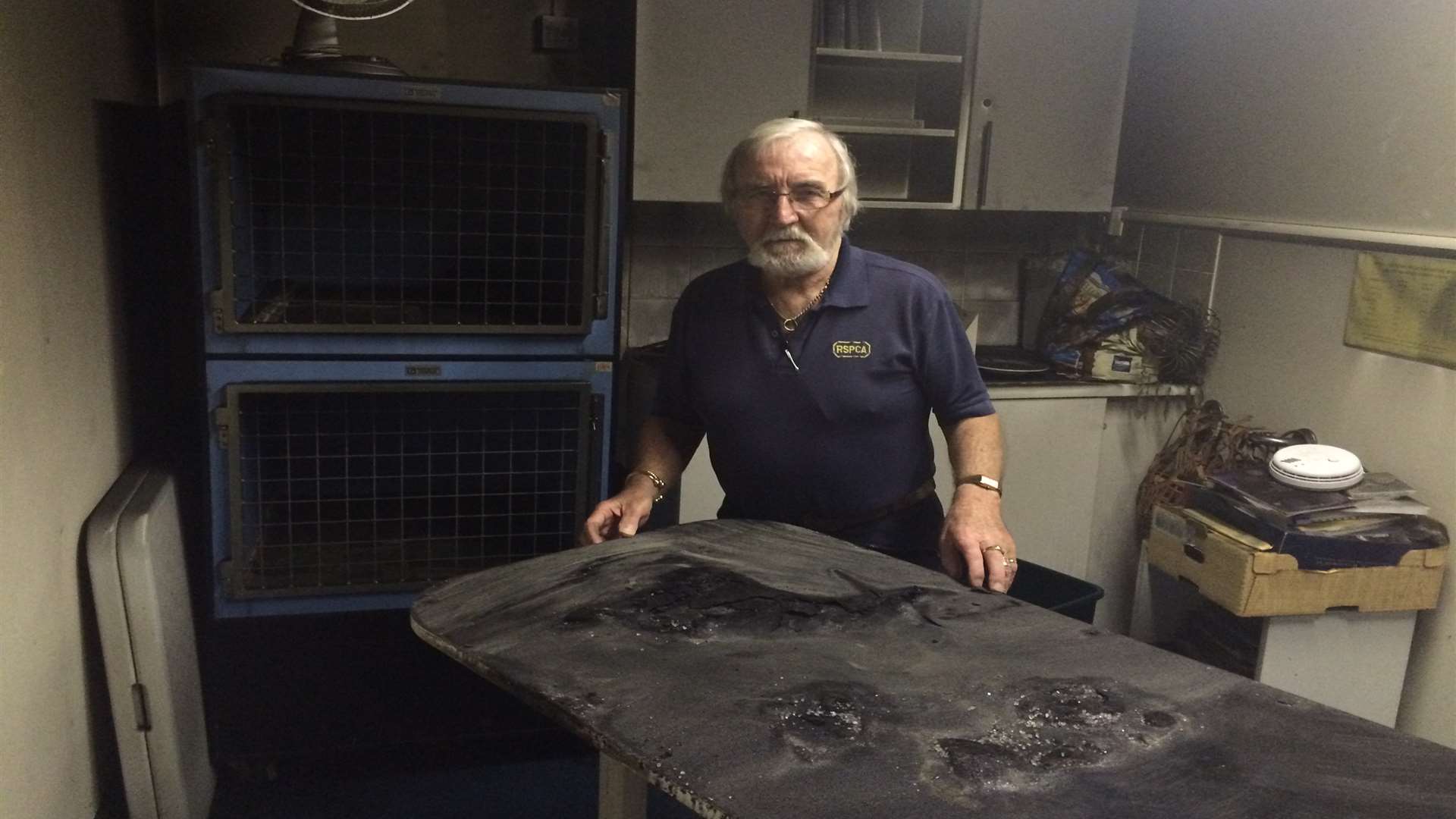 Volunteer Michael Mills by the treatment table where the fire started