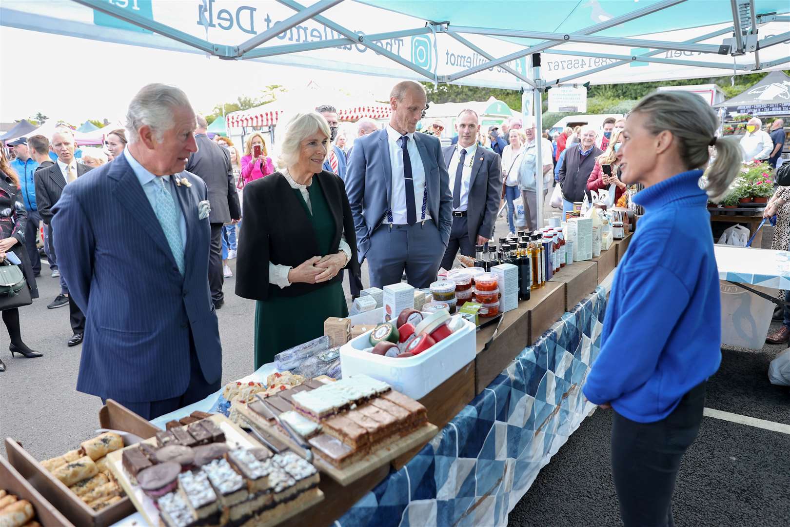 Charles and Camilla chatted to stallholders as they looked at the produce on offer (Chris Jackson/PA)