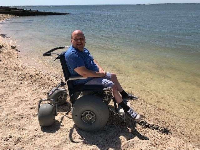 Craig Potter in one of the Beach Within Reach wheelchairs. Pic: Canterbury City Council (14518534)