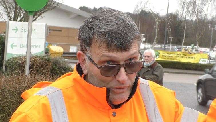 John Lawrence, 66, from Chatham, is protesting outside Asda