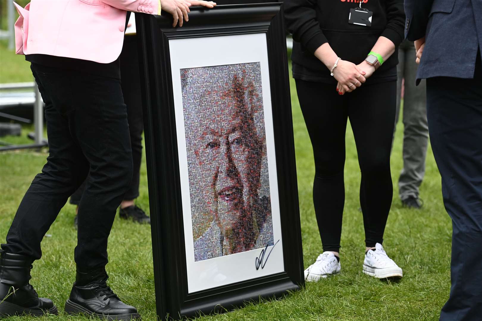 A collage by artist Nathan Wyburn depicting Britain’s Queen Elizabeth II during a visit by the Duke and Duchess of Cambridge to Cardiff Castle to meet performers and crew involved in the Platinum Jubilee Celebration Concert taking place in the castle grounds later in the afternoon, as members of the royal family visit the nations of the UK to celebrate Queen Elizabeth II’s Platinum Jubilee (Ashley Crowden/PA)