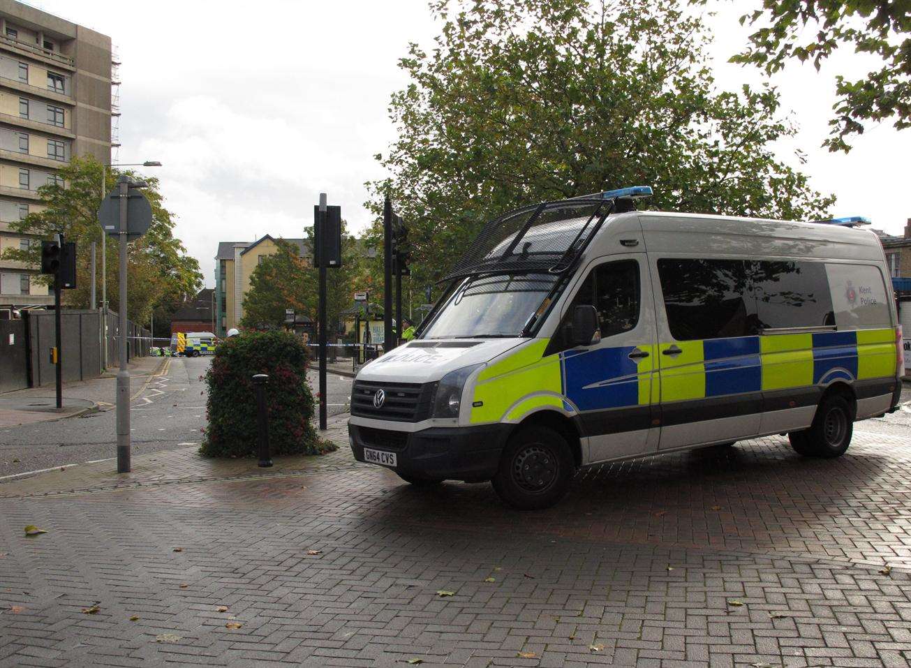 A police van parked outside the Panorama building, where Mr Males's body was discovered