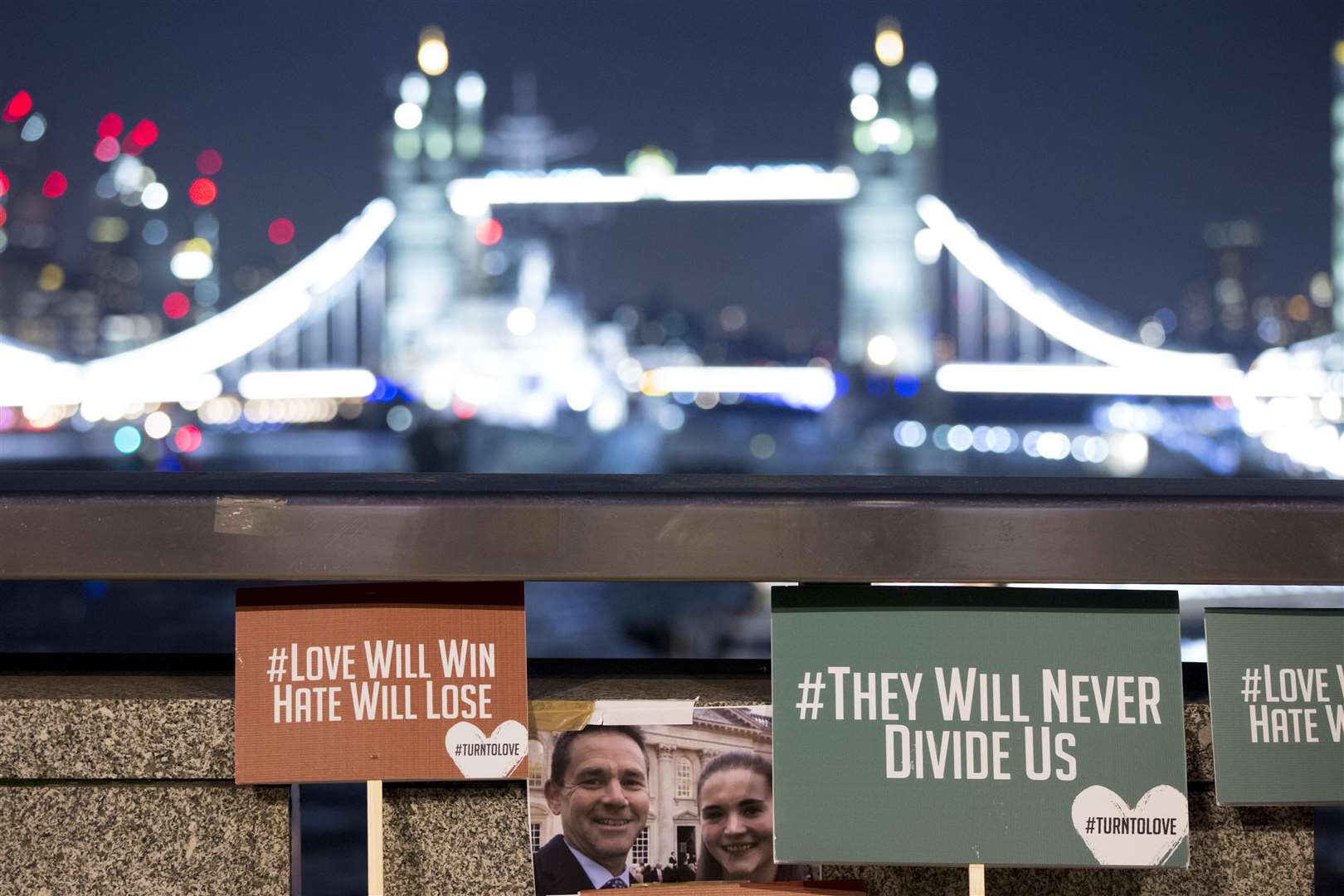 Tributes to Cambridge University graduates Jack Merritt, 25, and Saskia Jones, 23, on London Bridge (Rick Findler/PA)