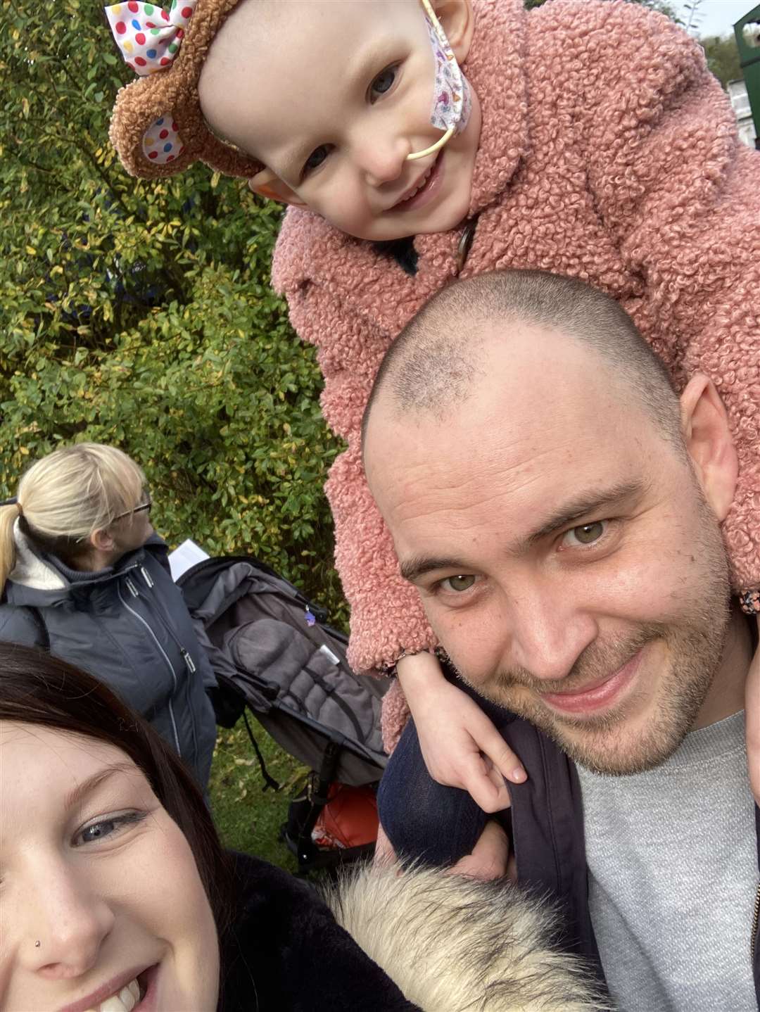 Nellie-Rose Culleton with her parents Leighann Lynes and Gavin Culleton (Family Handout/PA)