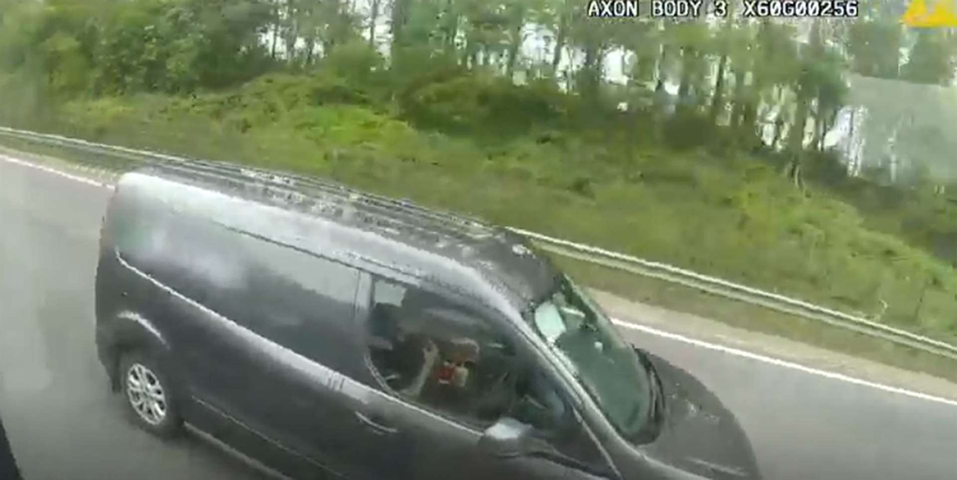 A van driver driving without his hands on the wheel eating fast food on the M6 in Coventry (National Highways/PA)
