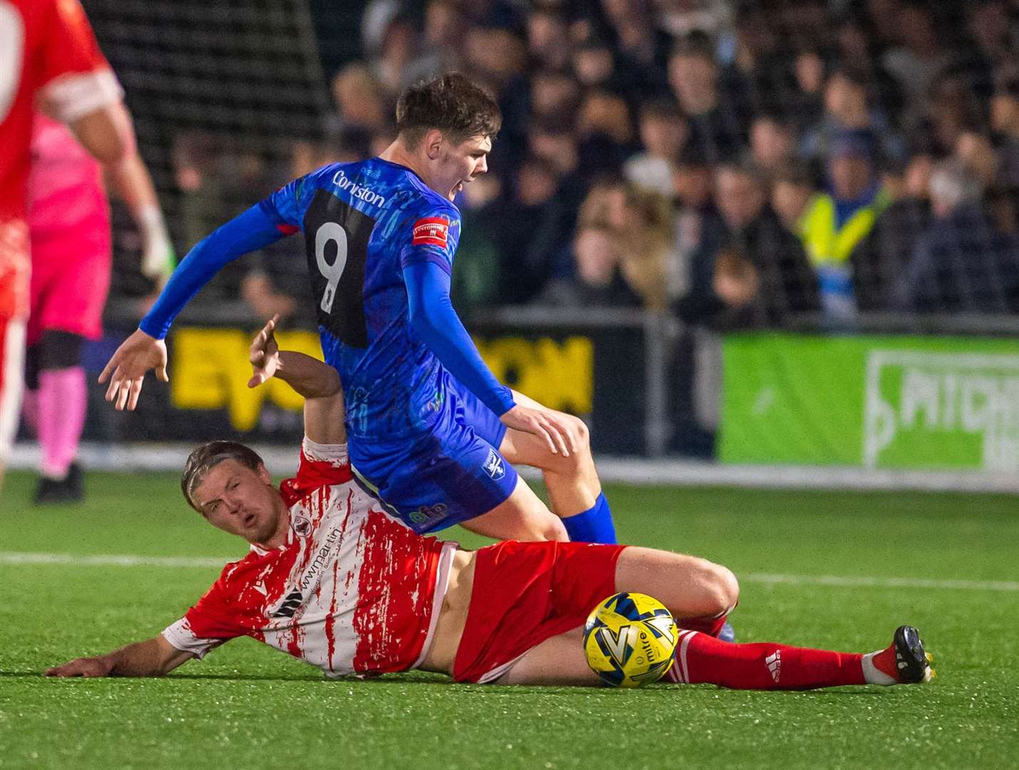 Ramsgate defender Ben Fitchett tackles Margate forward Harvey Smith at Hartsdown Park on Tuesday night. Picture: Ian Scammell