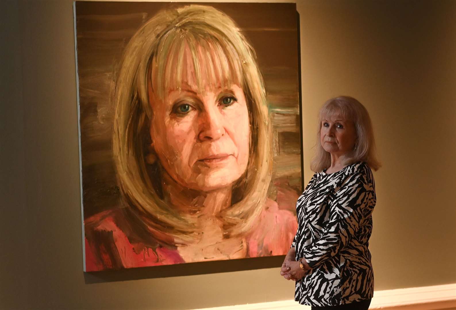 Mo Norton with her portrait (NMNI/PA)