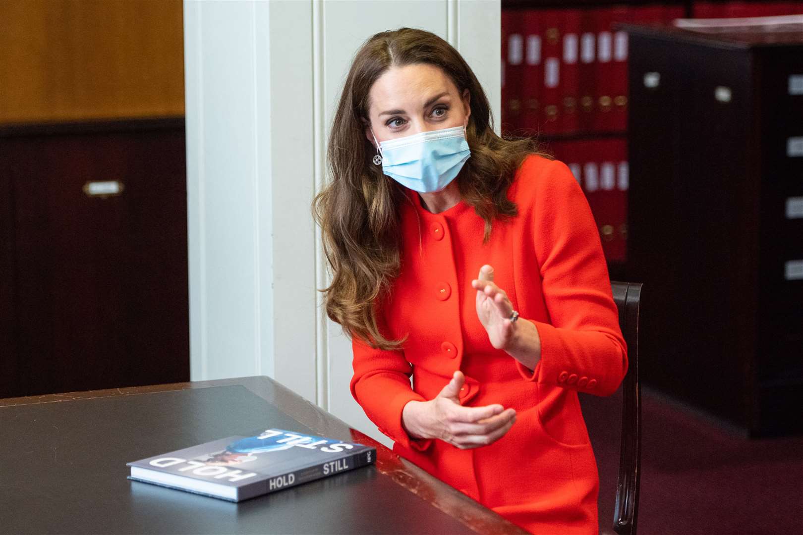 Kate with the book of her Hold Still photographic project (Dominic Lipinski/PA)