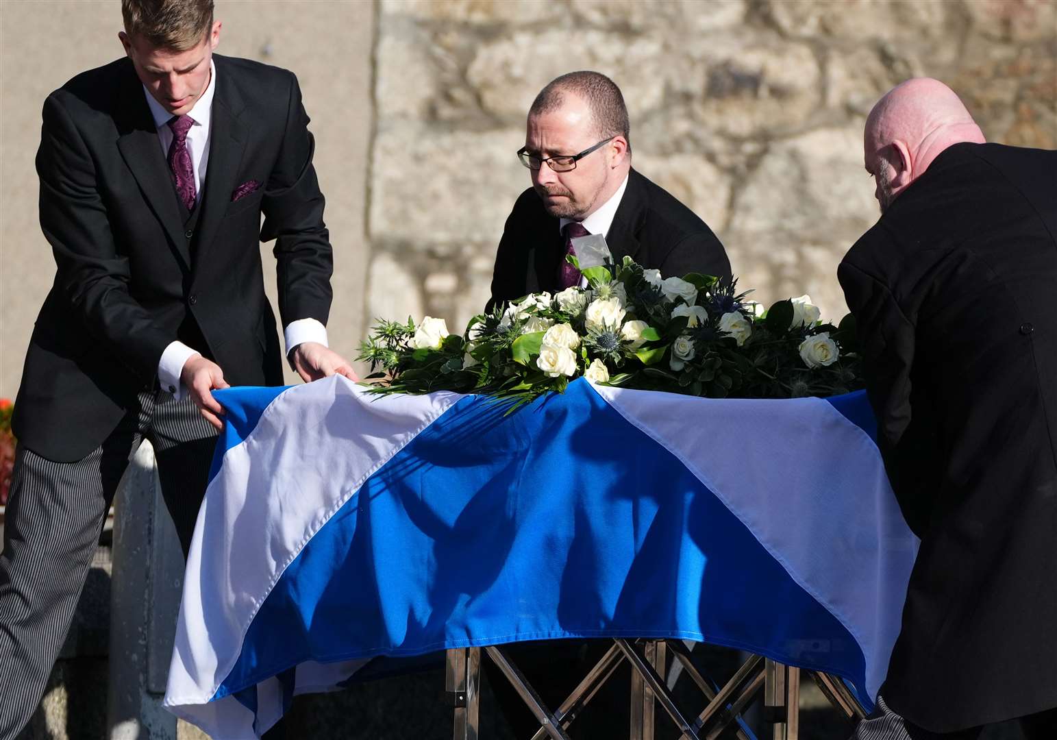 Pall bearers with the coffin of former first minister of Scotland Alex Salmond (Andrew Milligan/PA)