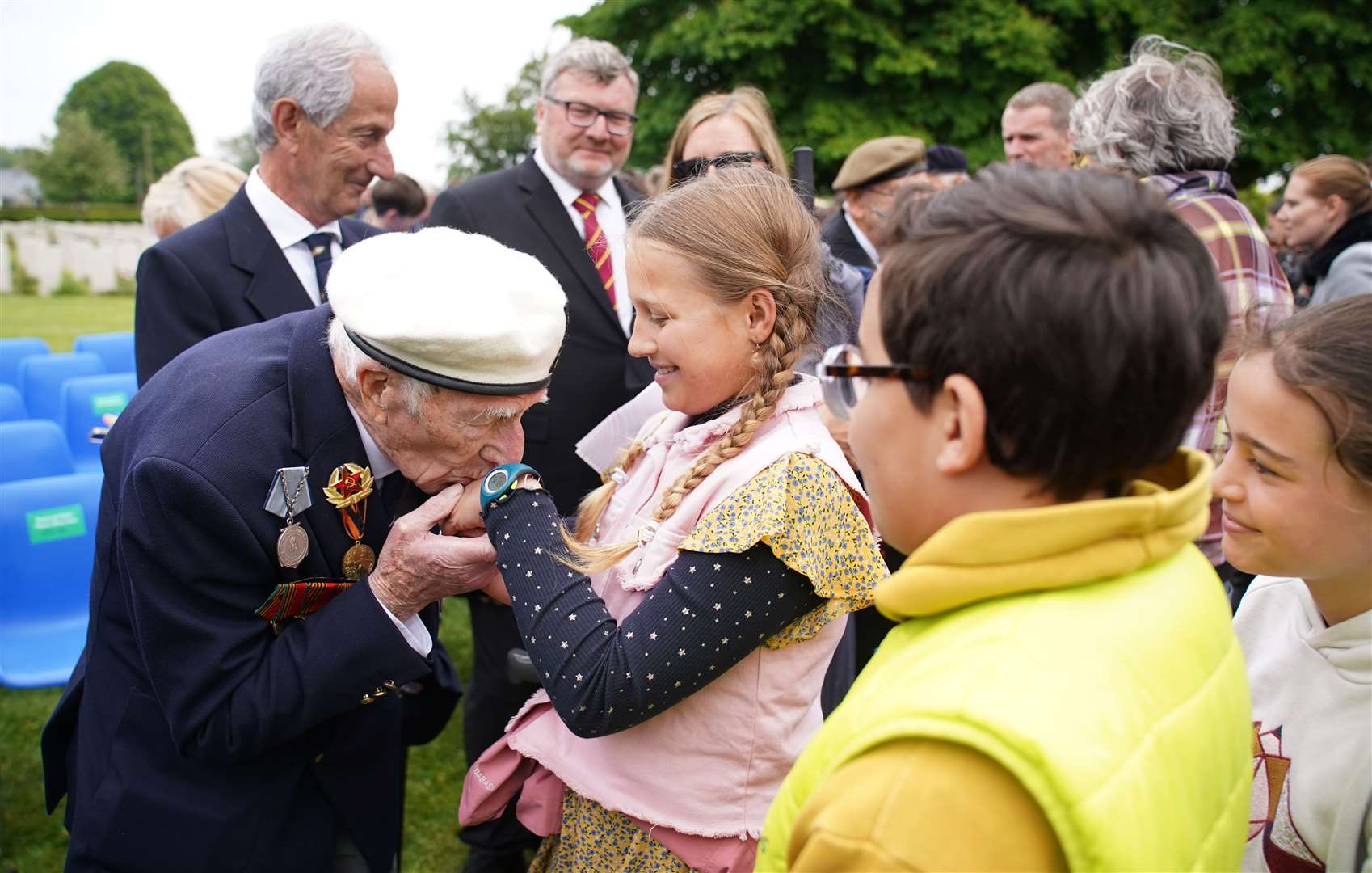 D-Day veteran Alec Penstone meets local children after the service (Gareth Fuller/PA)