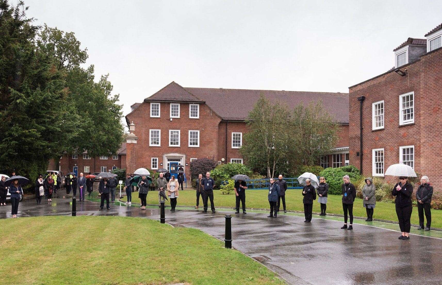 Officers and staff pay their respects at the Sutton Road HQ