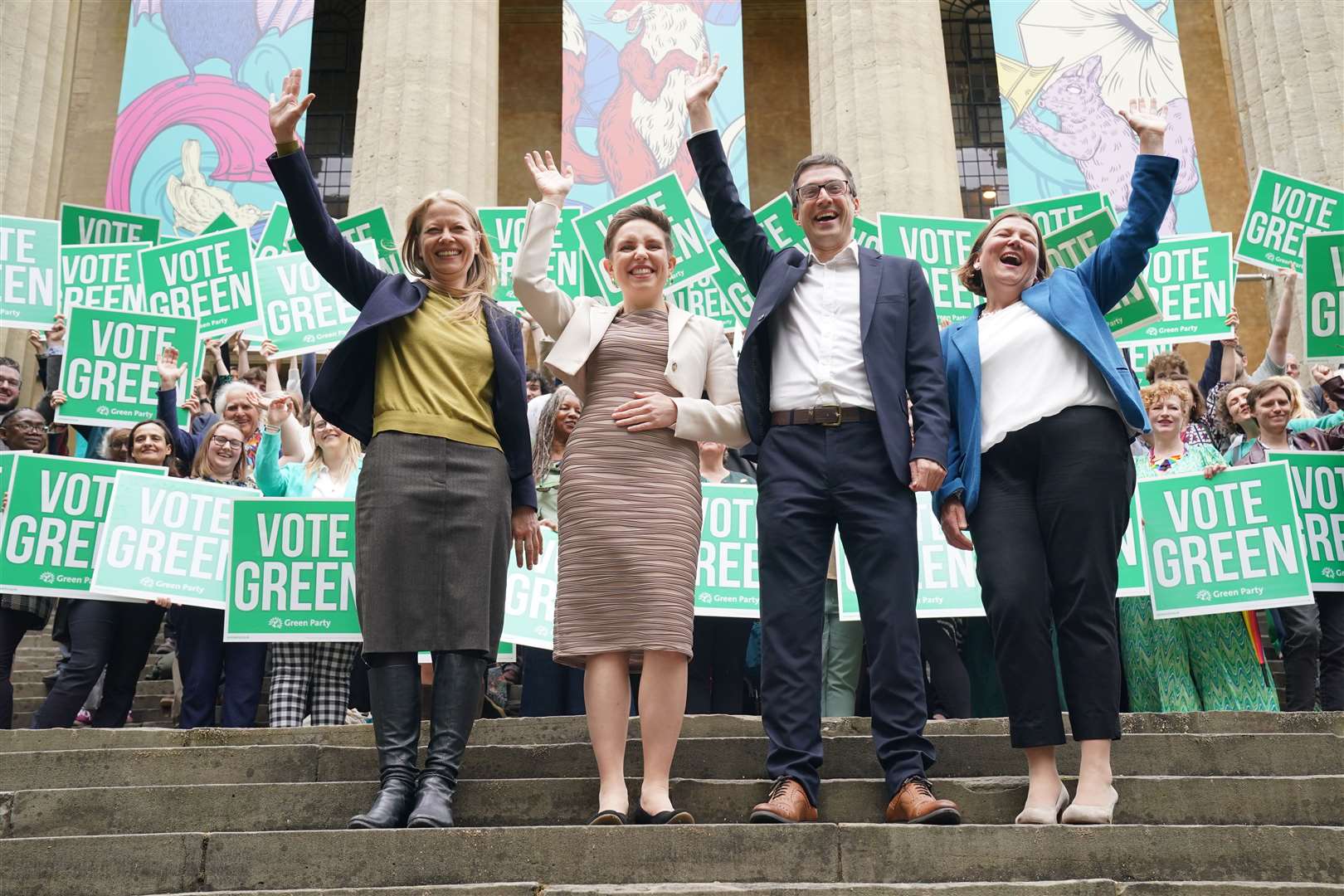 Green Party parliamentary candidates (left to right) Sian Berry, Carla Denyer, Adrian Ramsay and Ellie Chowns wave to supporters (Jonathan Brady/PA)