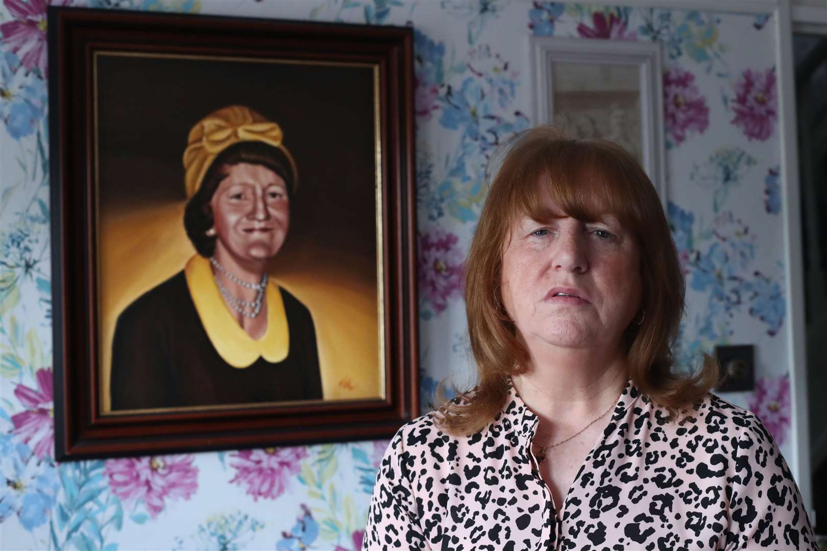 Briege Voyle with a picture of her mother, Joan Connolly (Niall Carson/PA)