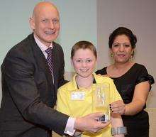 Alec Martin accepting his award from Duncan Goodhew and Sangeeta Bharbra