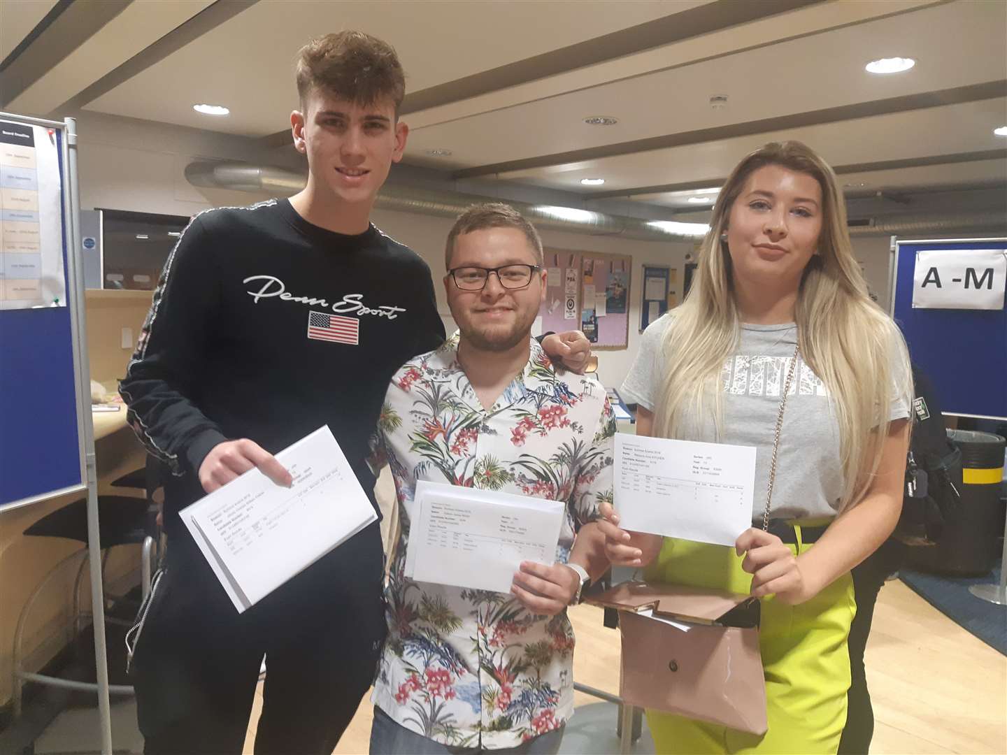 James Finch, Callum Beer and Rebecca Kitchen of Thomas Aveling School picking up their A-level results (15276209)
