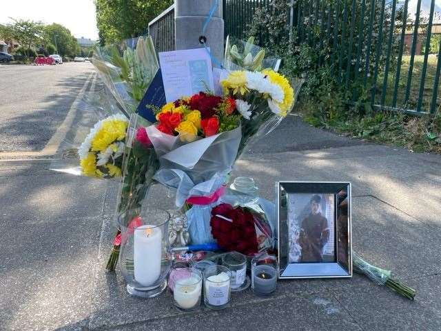 Tributes left near the scene at Langworthy Road in Salford (Richard McCarthy/PA)