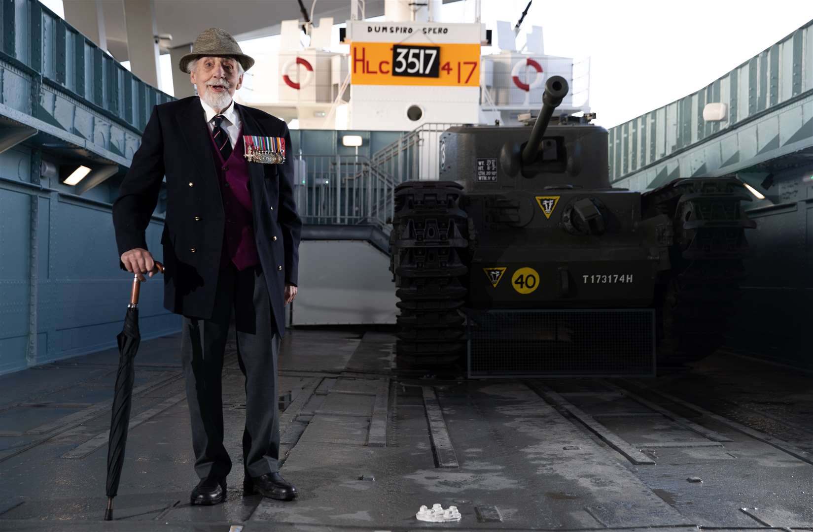 Veteran James Rawe, who served as a crewman on LCT 1051, poses for a photograph onboard the restored vessel (Andrew Matthews/PA)