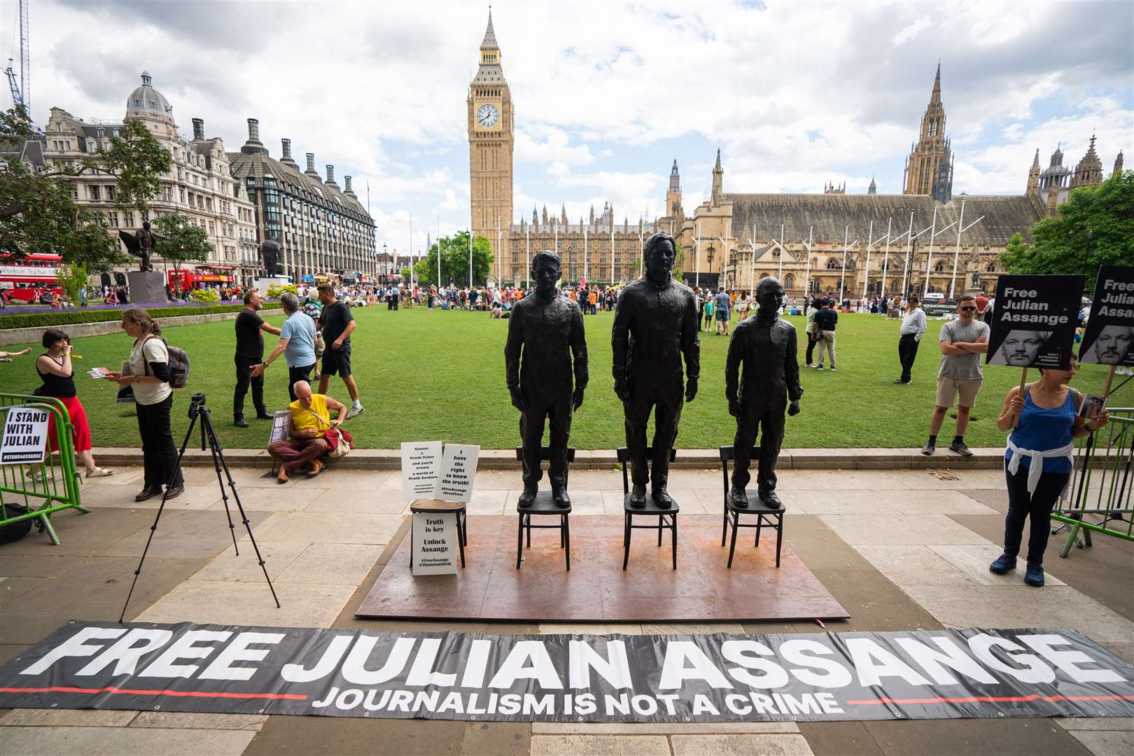 A sculpture called Anything To Say, which features life-sized bronze figures of whistleblowers (left-right) Edward Snowden, Julian Assange and Chelsea Manning, was unveiled at Parliament Square in London in 2023 (PA)