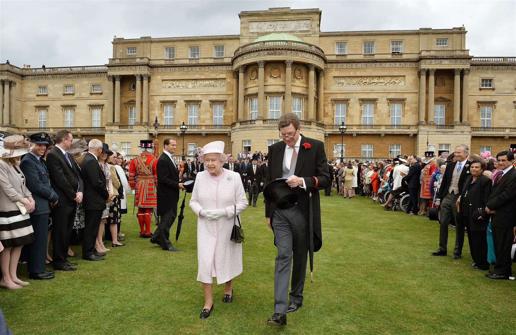 The Queen with the Earl Peel at a garden party in the grounds of Buckingham Palace (John Stillwell/PA)