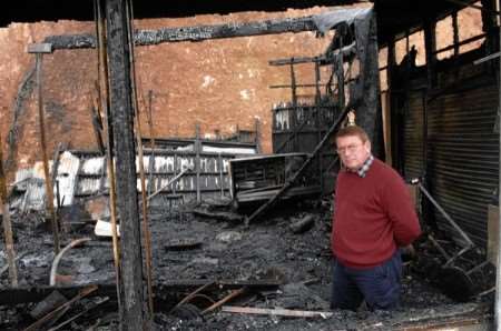 The devastation after the fire. Club secretary Chris Lucy looking at the damage. Picture Terry Scott