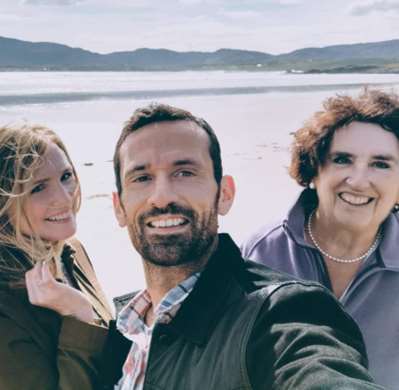 Tim Edwards with his wife Roisin Gallagher and mother Jenny Edwards (Family handout/PA)