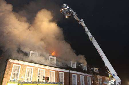 Fire crews battle a blaze in West Malling High Street on January 11, 2013. Picture: Jeffrey Hurst