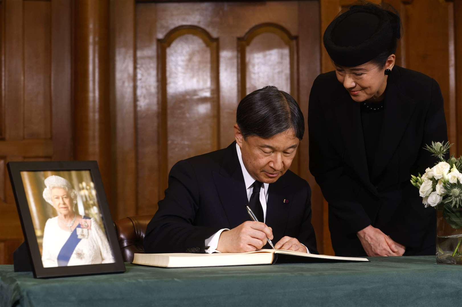 Emperor Naruhito and his wife, Empress Masako, signing a book of condolence for Queen Elizabeth II (David Parry Media Assignments/PA)