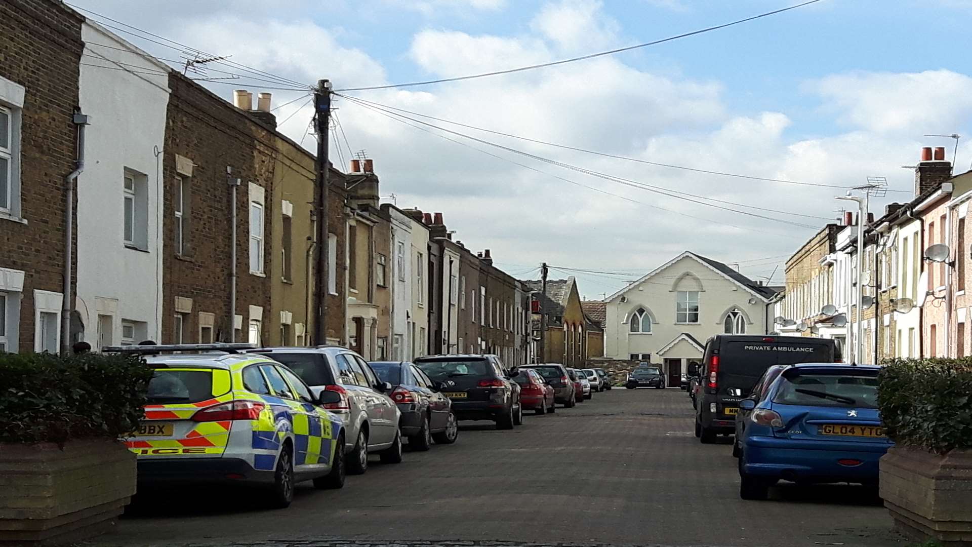 Police and an ambulance crew in Alma Street, Sheerness.