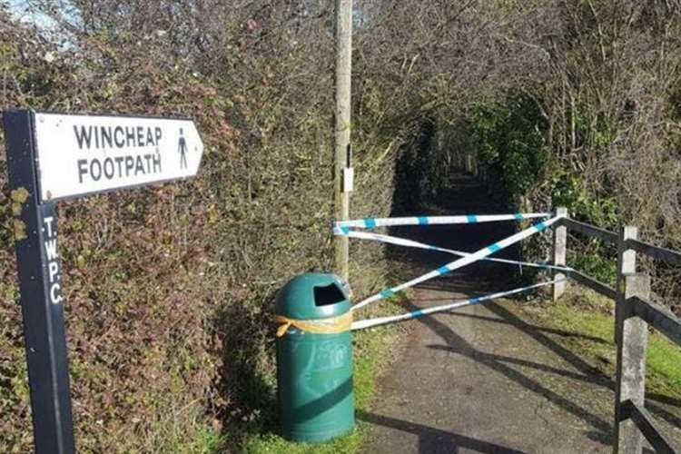 Police taped off a footpath near the field