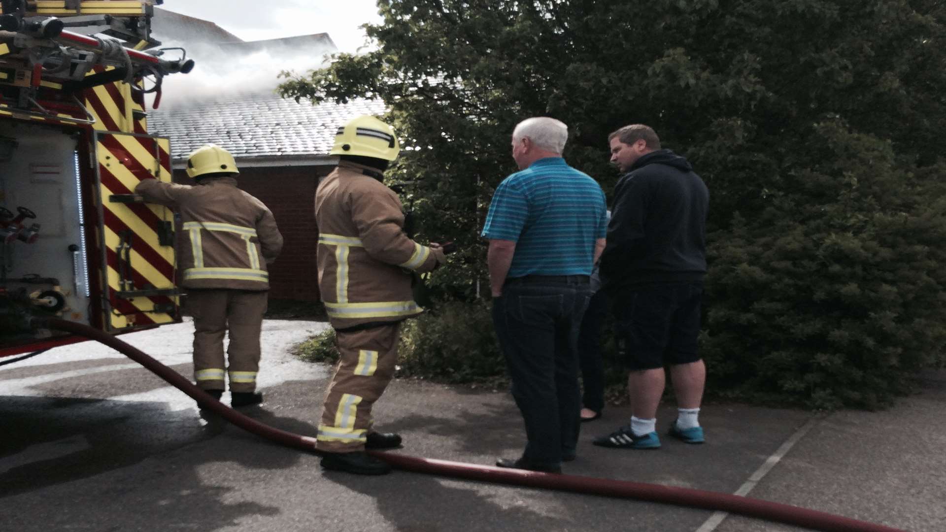 Firefighters at the scene of the garage fire