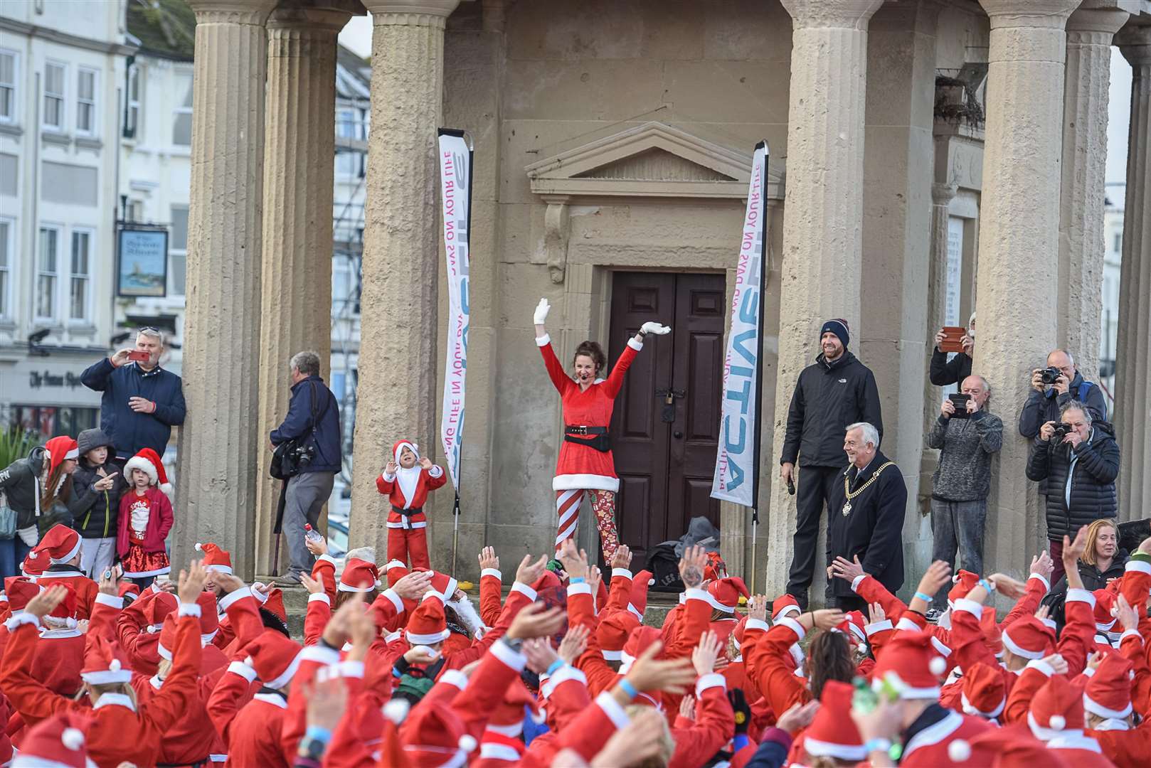 The runners warming up in front of the clock tower