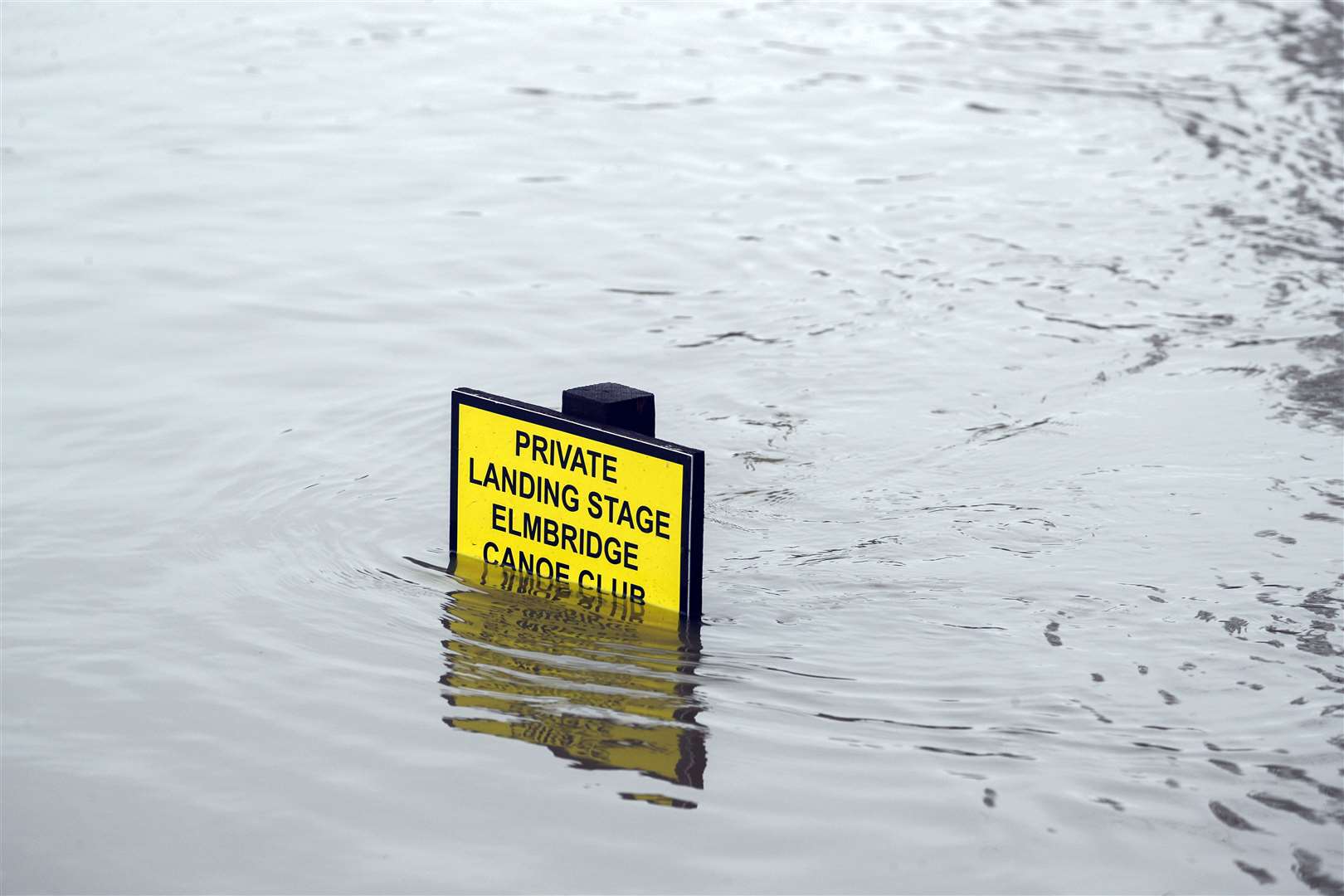 A partly submerged sign in Weybridge, Surrey, during Storm Christoph (Steve Parsons/PA).