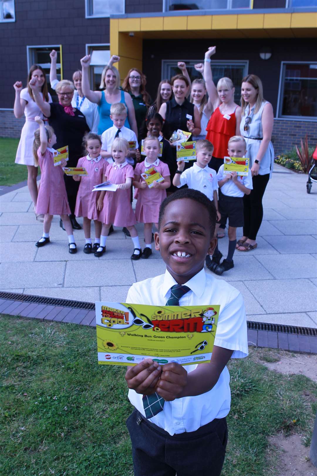 Six-year-old Ifunanya and staff, parents and classmates from Valley Invicta Primary at Holborough Lakes at the launch of the primary’s Walking Bus. Picture: John Westhrop