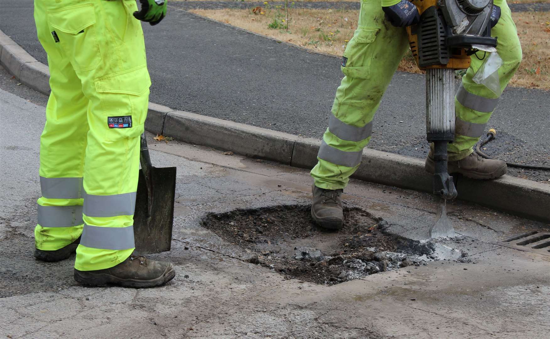 A pothole being filled