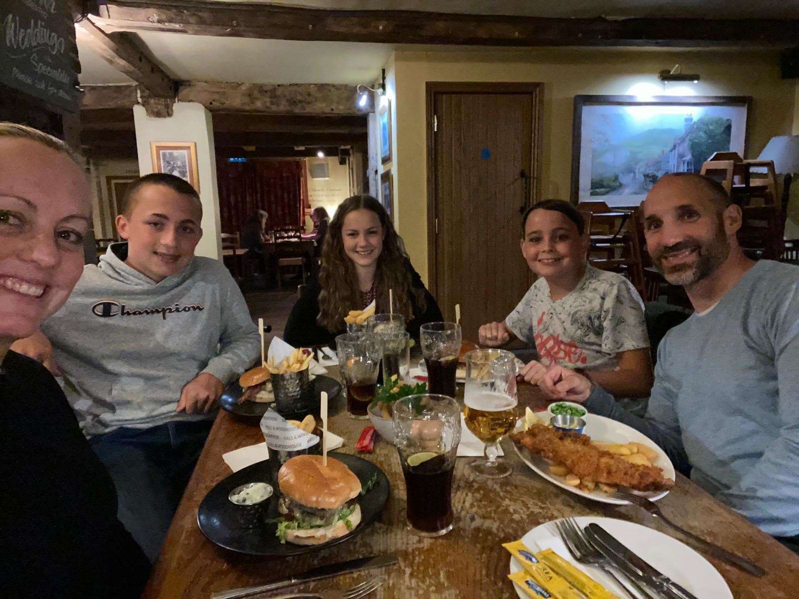 (From left) Sam Shaw, Owen Shaw, Ellen Shaw, Benjamin Shaw and Mark Shaw out celebrating the end of Benjamin's 13th radiotherapy session last September. Picture: Sam Shaw