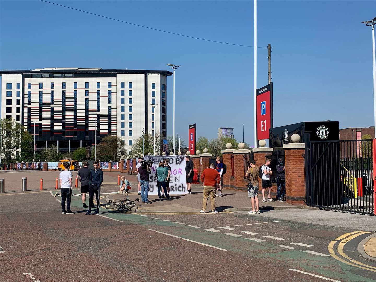 Crowd outside Old Trafford protesting against the European Super League (Gemma Bradley/PA)