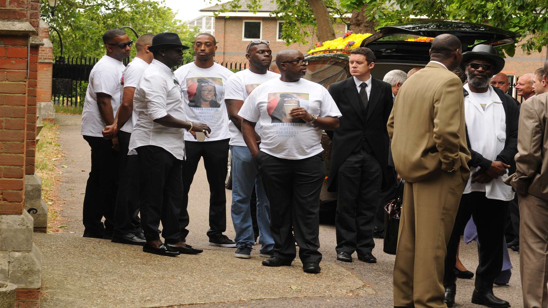 Mourners outside the church.