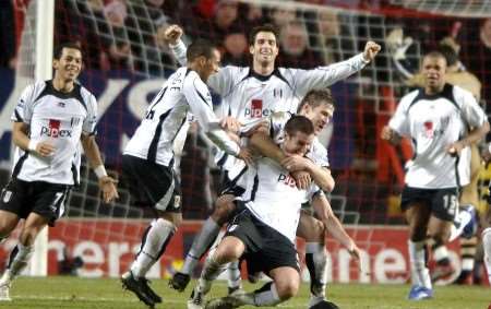 CRUEL BLOW: Fulham players celebrate Frank Queudrue's last-gasp equaliser. Picture: MATT WALKER