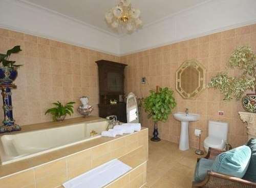 The bathroom is in a muted shade. Picture: Terence Painter