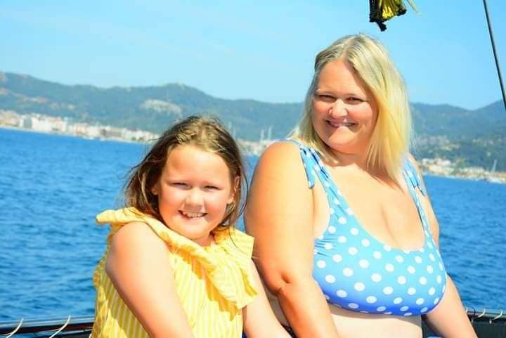 Tilly with her mum Vicky Hall-Newman on a boat trip before she fell ill again