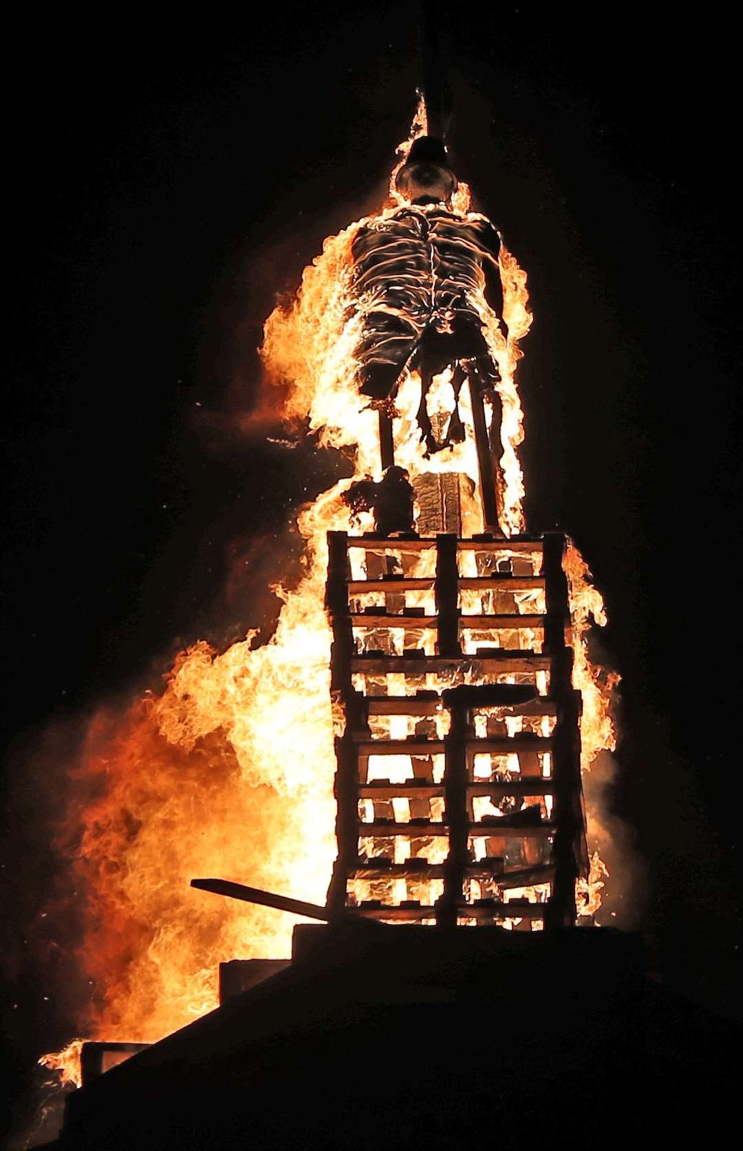 A effigy of the historical figure Robert Lundy is burned (Niall Carson/PA)