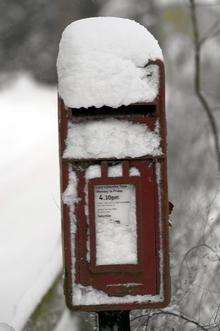 A pillar box, in the snow in Ashford
