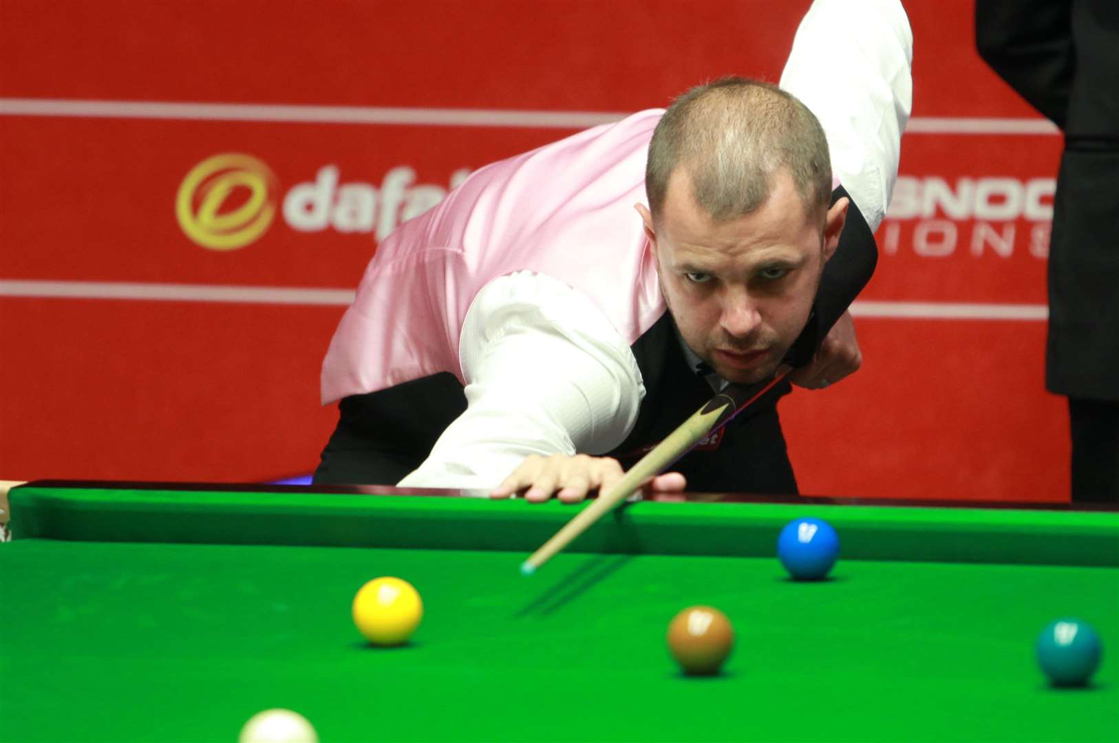 Barry Hawkins will face world champion Judd Trump in the next round of the Championship League snooker tournament