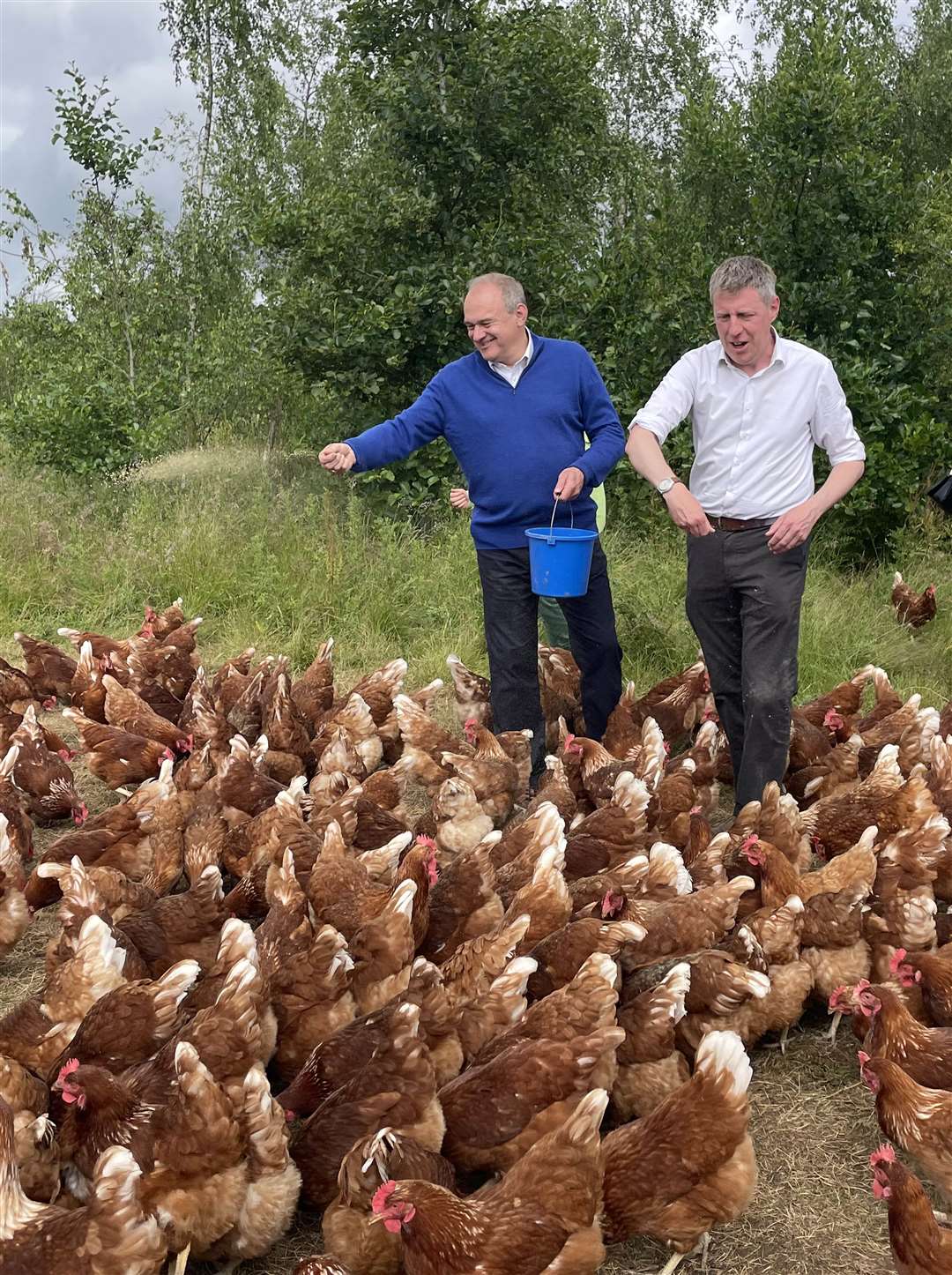 Liberal Democrat leader Sir Ed Davey, left, with Lib Dem candidate for Lewes James MacCleary during a visit to The Mac’s Farm in Ditchling, East Sussex (Anahita Hossein-Pour/PA)