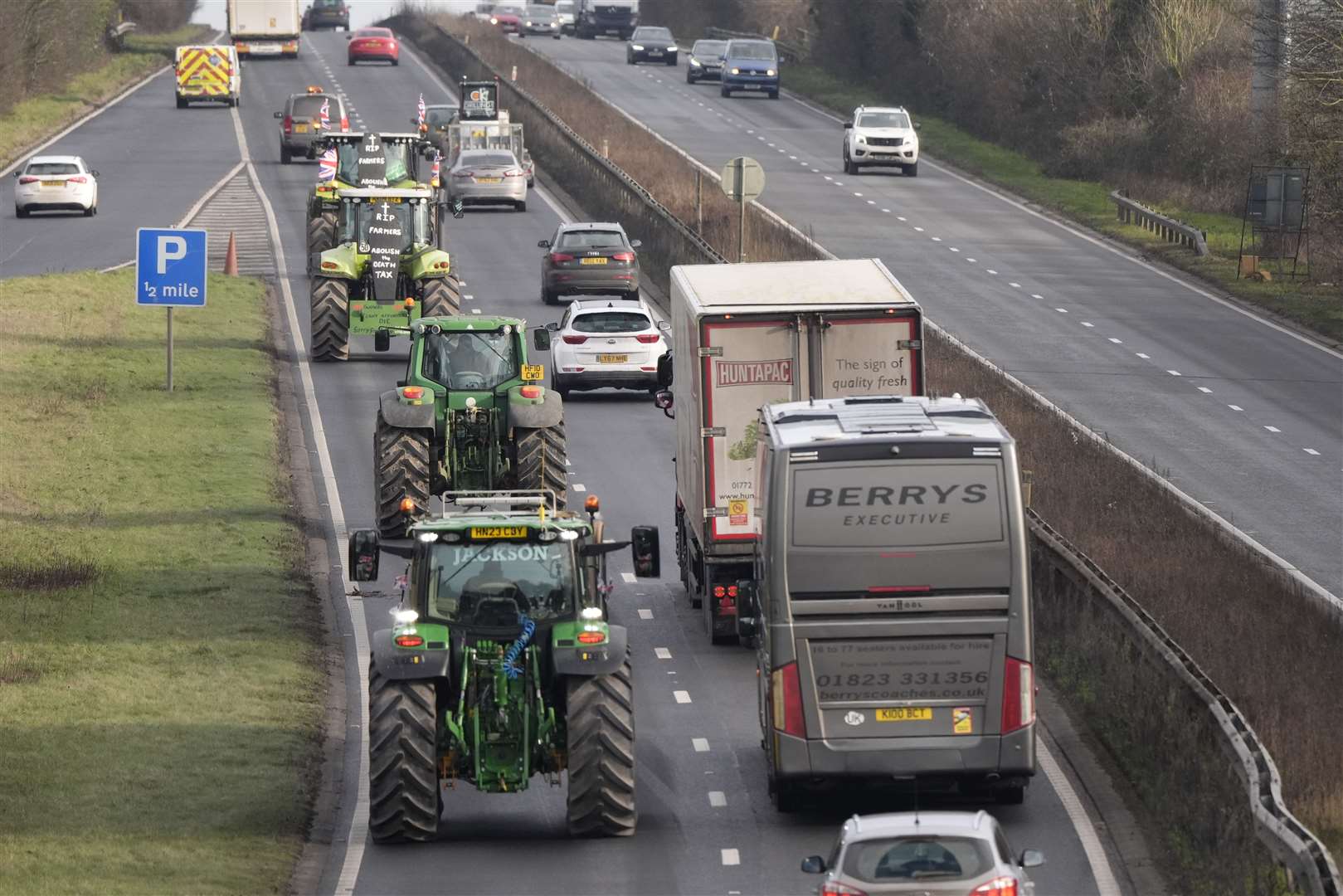 Farmers in tractors make their way along the A303 near Andover, Hampshire (Andrew Matthews/PA)