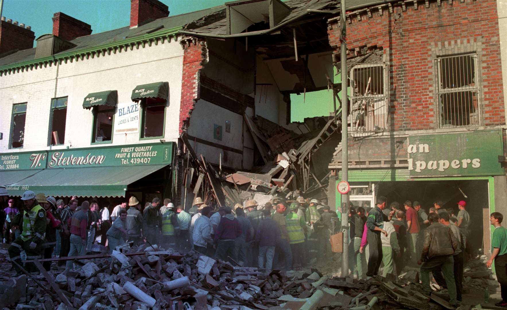 The aftermath of the IRA bombing of a fish shop on the Shankill Road in Belfast in 1993 which killed 10 people including one of the bombers and injured almost 60 (PA)