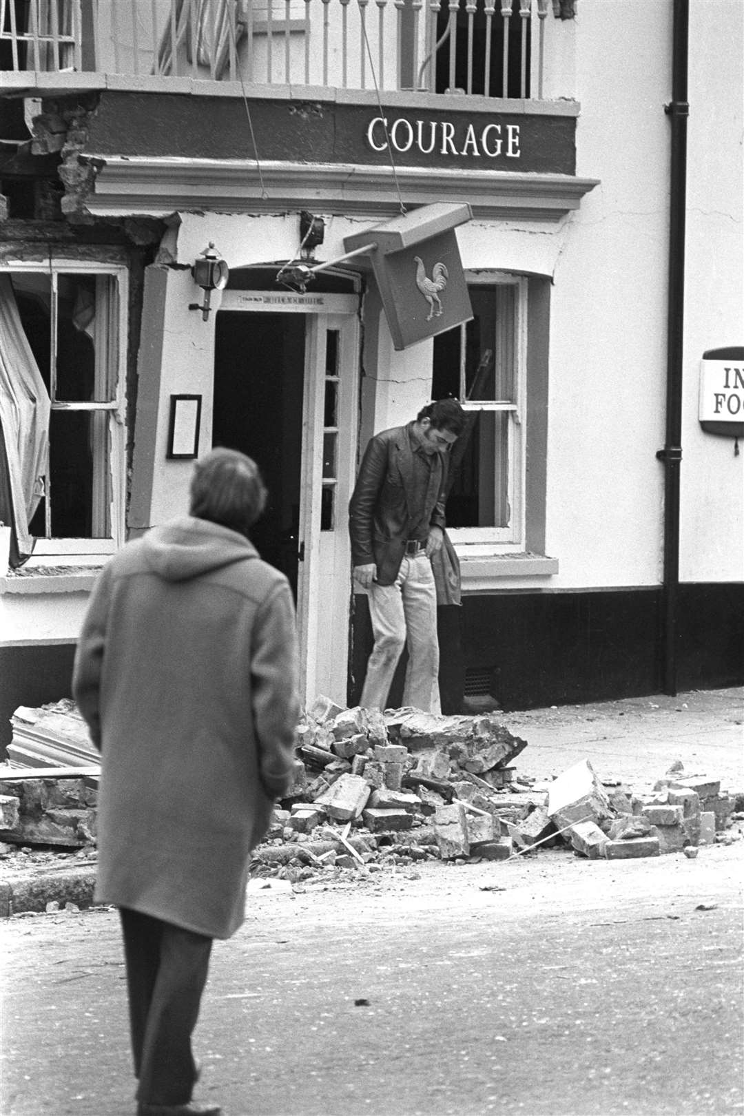 Alan Bristow, acting manager of the Horse and Groom public house in North Street, inspects the bomb damage (PA)