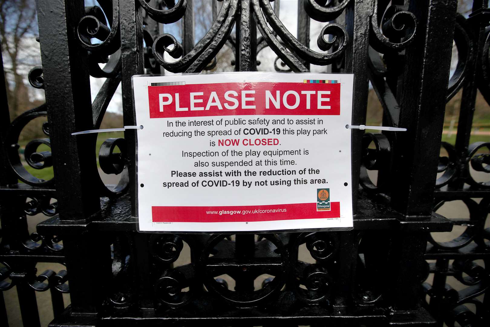 A Covid-19 sign saying the play park is closed at the entrance to Kelvingrove Park in Glasgow (Andrew Milligan/PA)