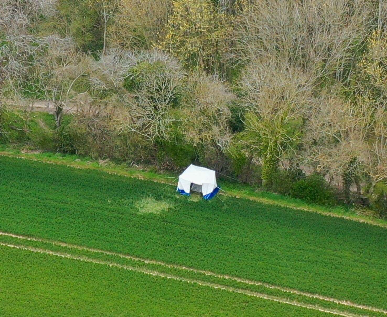 A police tent in a field in Snowdown where officers found the body of PCSO Julia James. Picture: UKNIP